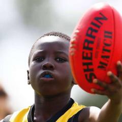 boy punting ball